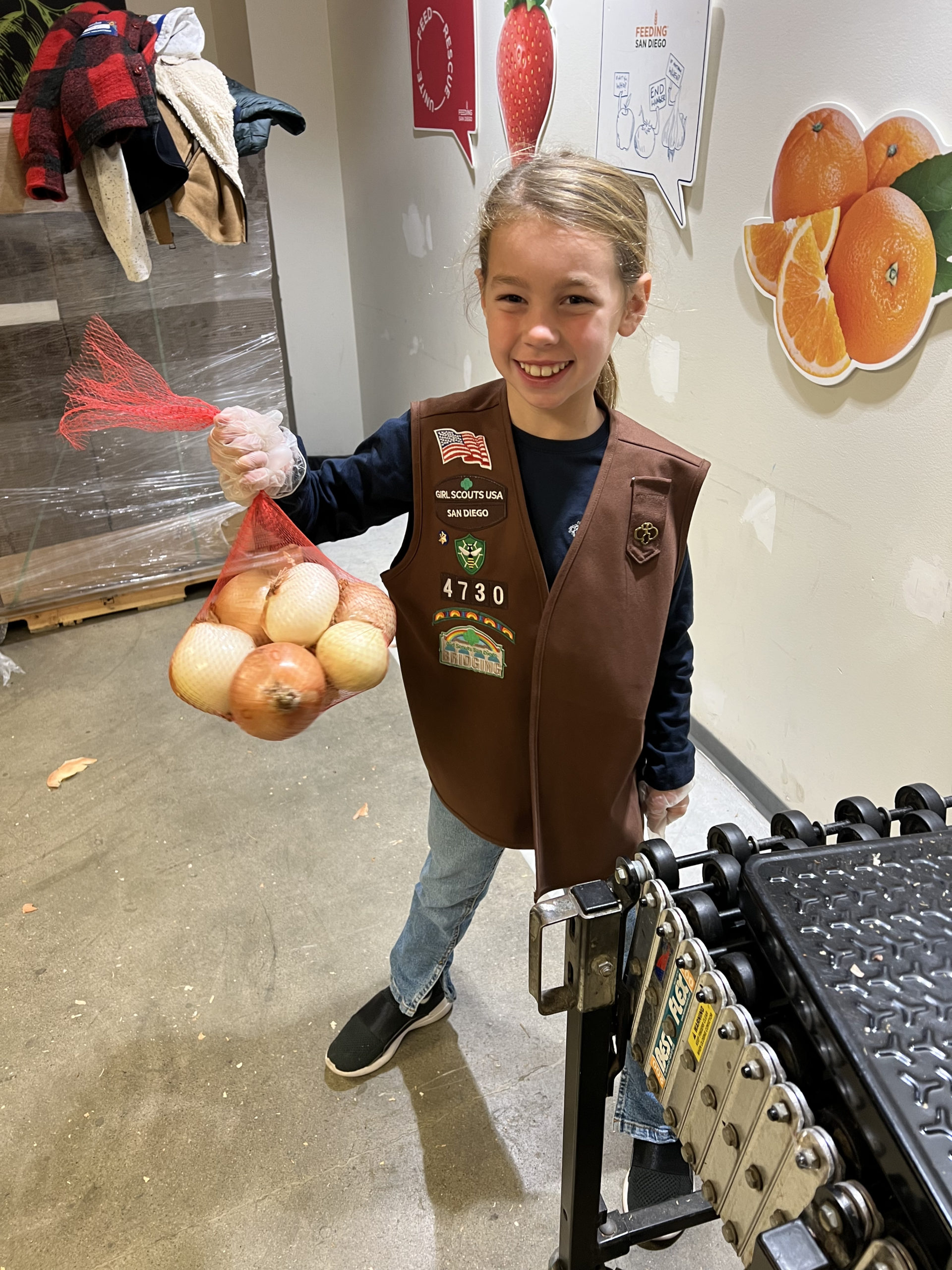 child with bag of onions